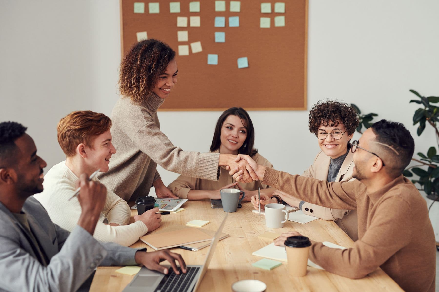 A diverse enterprise team collaborating around a conference table