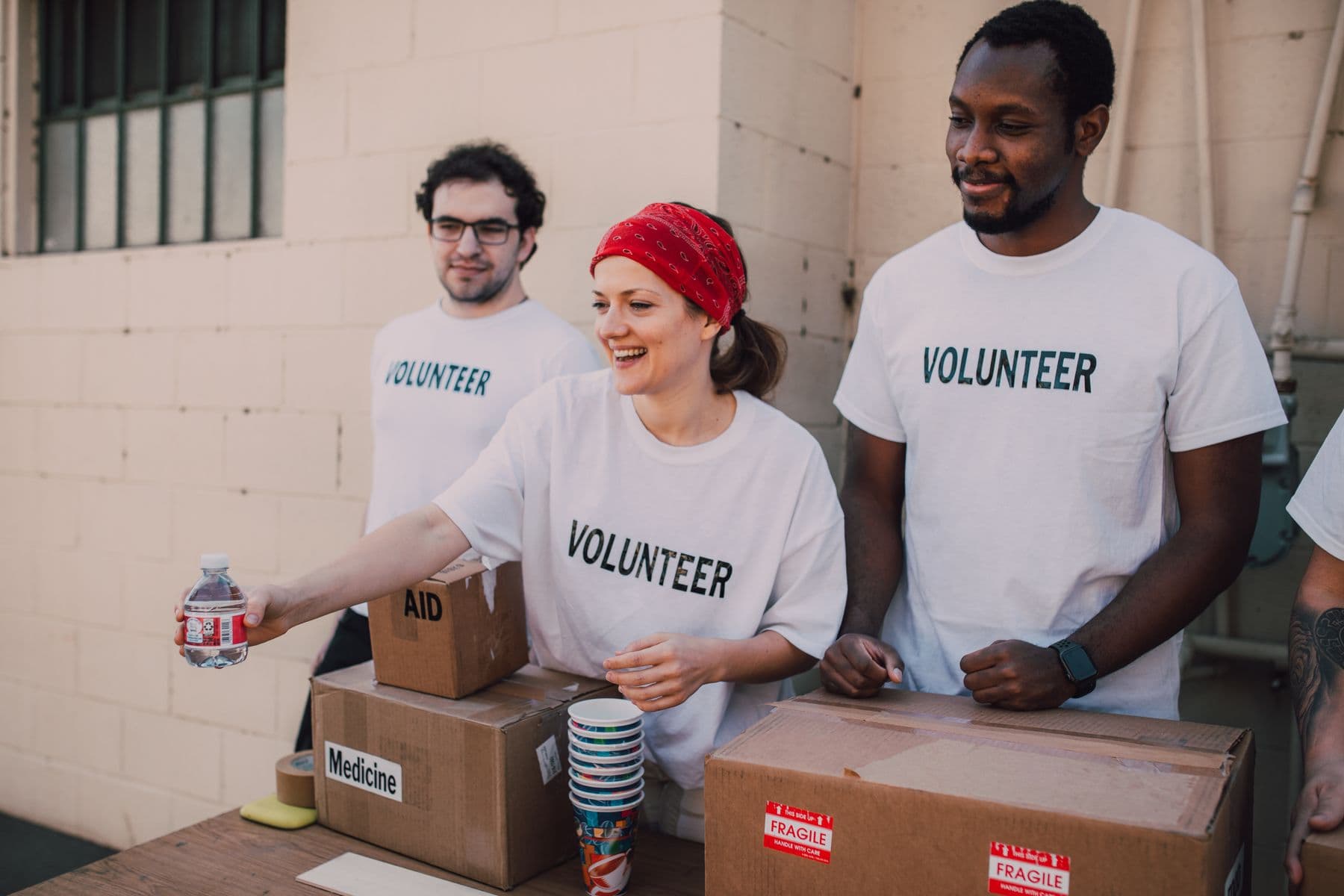 Nonprofit volunteers organizing community aid supplies