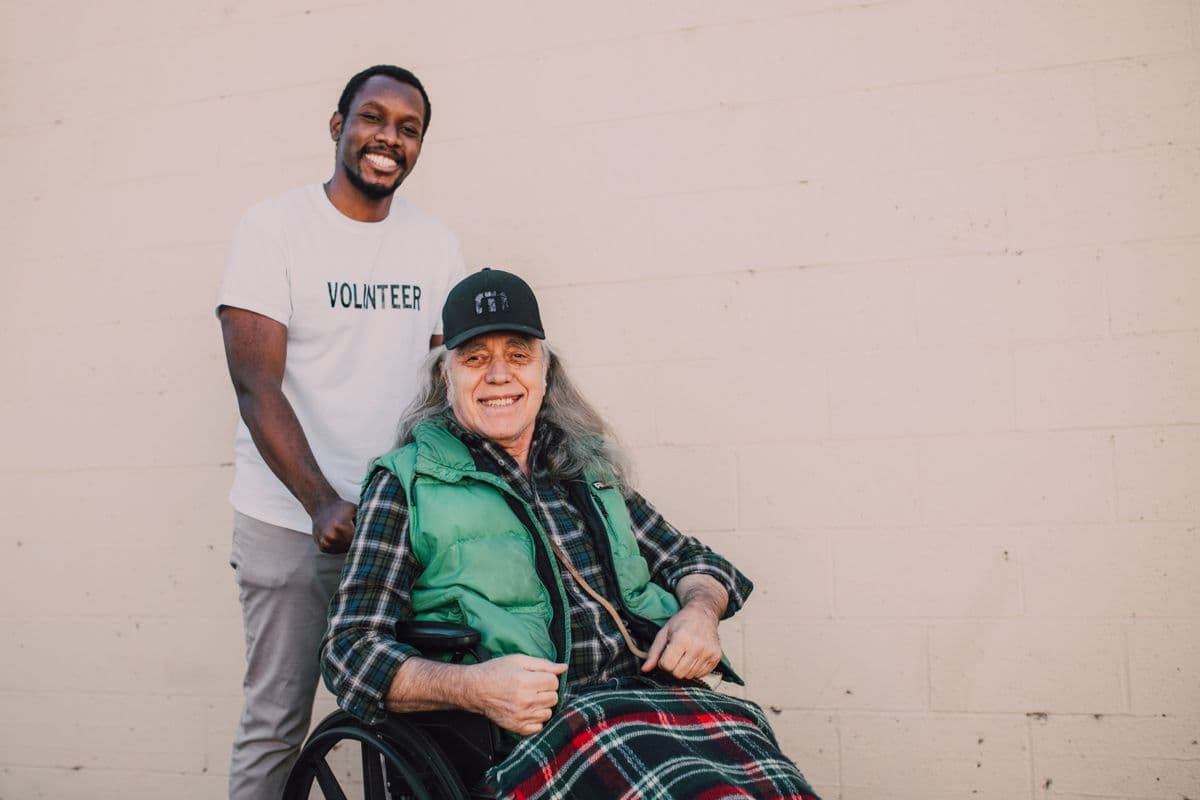 A volunteer and community member together